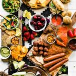 Overhead image of BBQ Graze Board with summer picnic and BBQ dishes