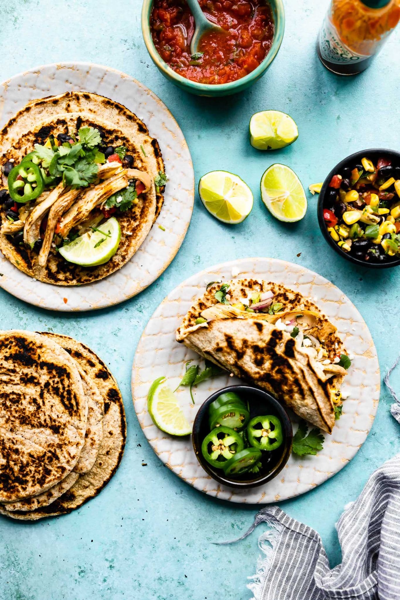 An overhead view of plates of tacos made with Coconut Flour Tortillas