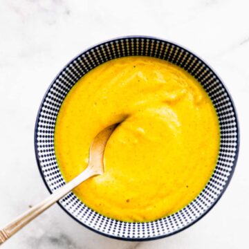 Overhead image of cheddar mac and cheese with a spoon.