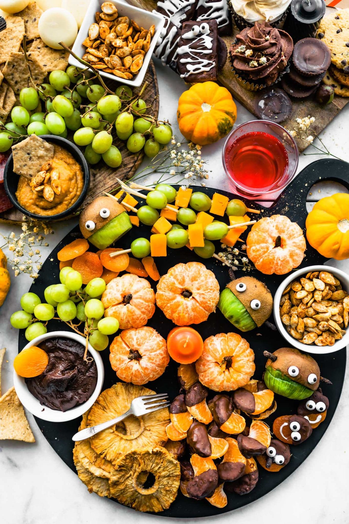 3 Halloween Charcuterie boards with fresh fruit, seeds, and healthy dips