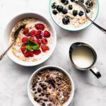 three bowls of n'oatmeal with difference toppings
