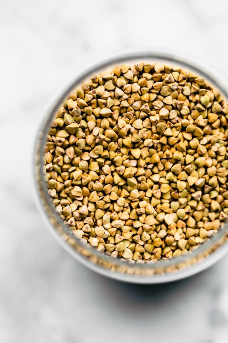 overhead image of buckwheat groats in a glass container
