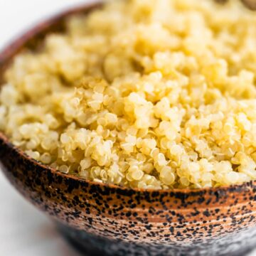 a bowl full of cooked qluten free quinoa grains