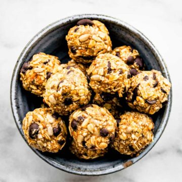 a bowl full of no bake cowboy cookie energy bites