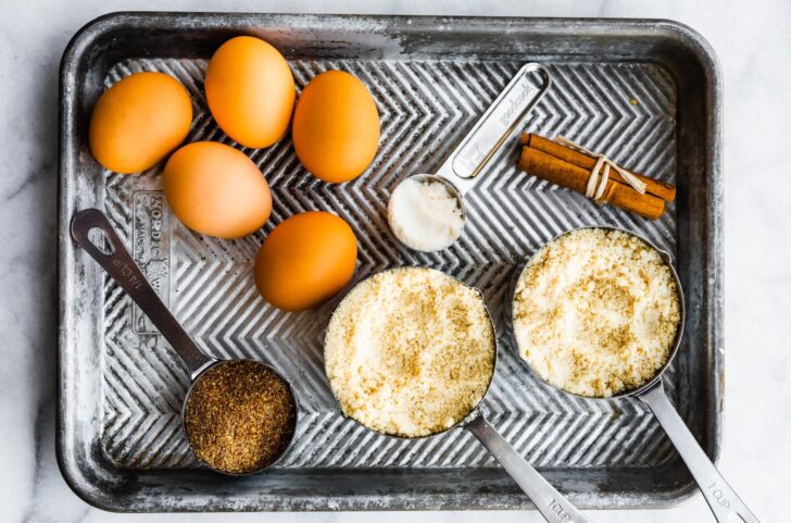 ingredients for cinnamon almond flour brad on a baking sheet
