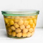 a jar of chickpeas in liquid