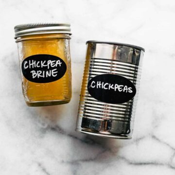 two jars one labeled chickpea the other labeled chickpea brine