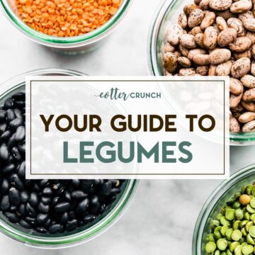 Bowls of dried legumes sitting on a white marble surface