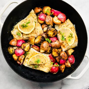 Easy Baked Fish and Vegetables in a pan ready to be served.
