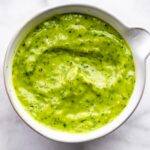 Vegan green goddess dressing in a white bowl.