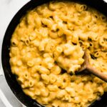Overhead photo of a gluten free macaroni and cheese in a black skillet.