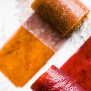 Overhead photo of two different colored fruit roll ups.
