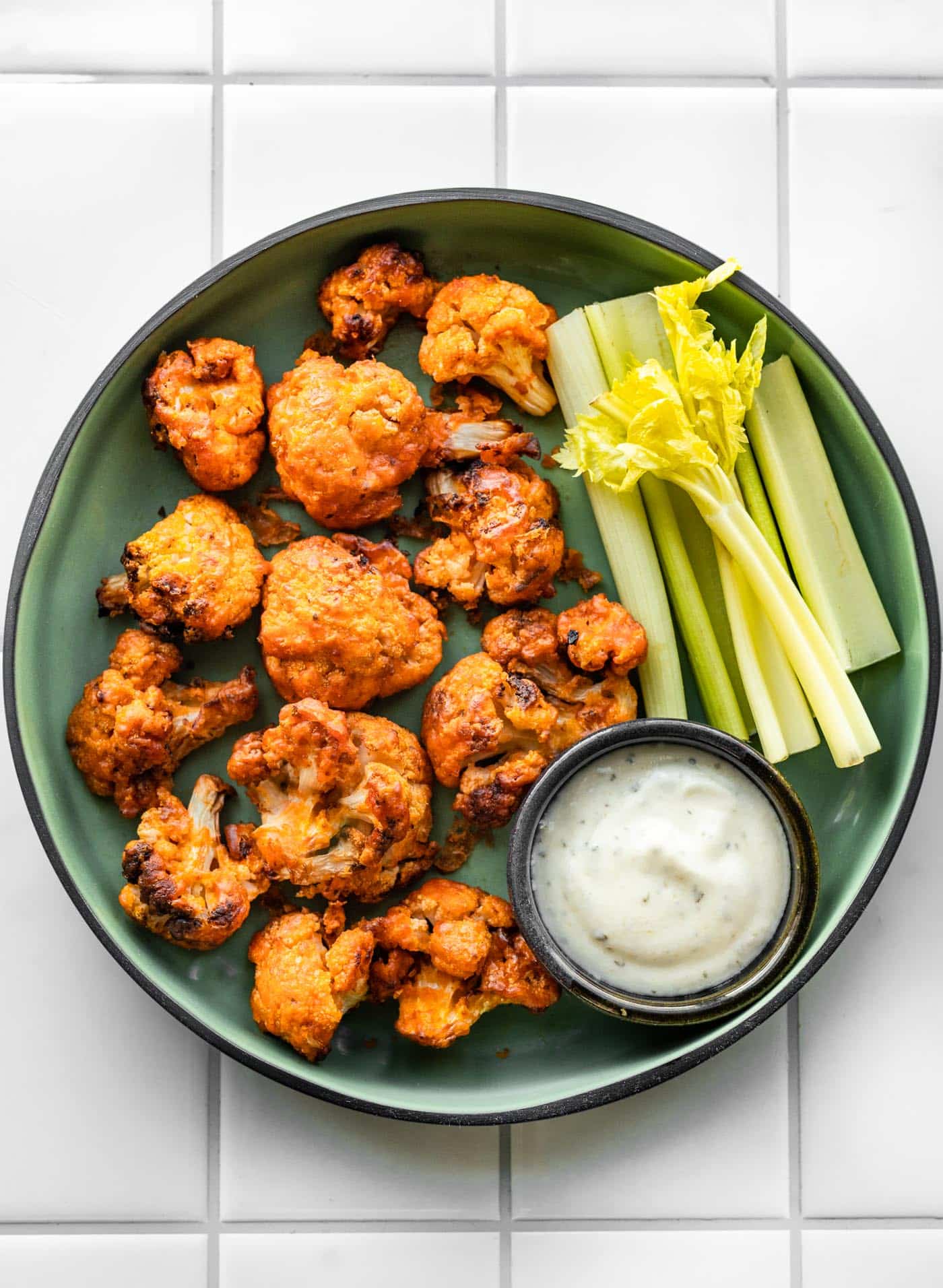 This vegan Air Fryer Buffalo Cauliflower Recipe comes together with a handful of simple ingredients in just 15 minutes! Quick and easy, it’s the perfect party appetizer, crowd-pleasing side dish, or low-carb snack!