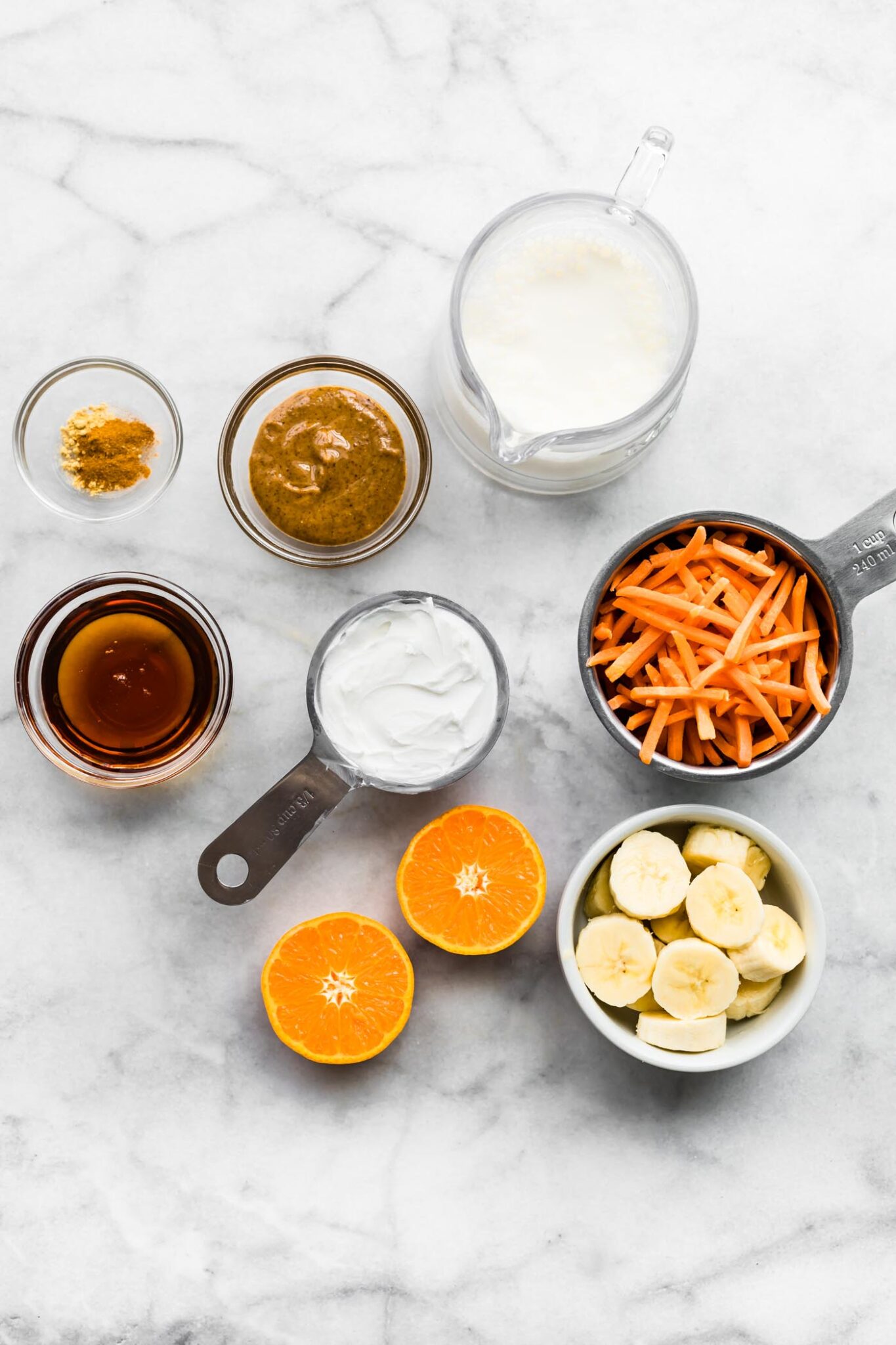 ingredients in bowls and measuring cups to make a smoothie