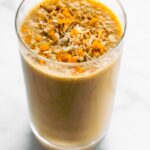 Carrot cake smoothie with shredded coconut on top