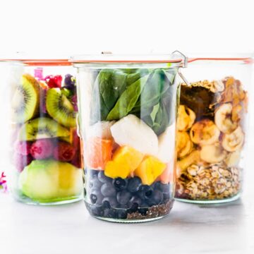 A photo of 3 glass jars of Make-Ahead Protein Smoothie Packs