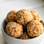 A small bowl of Coconut Bliss Balls