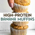 A hand stacking three freshly baked banana protein muffins in paper liners with a text overlay for Pinterest.